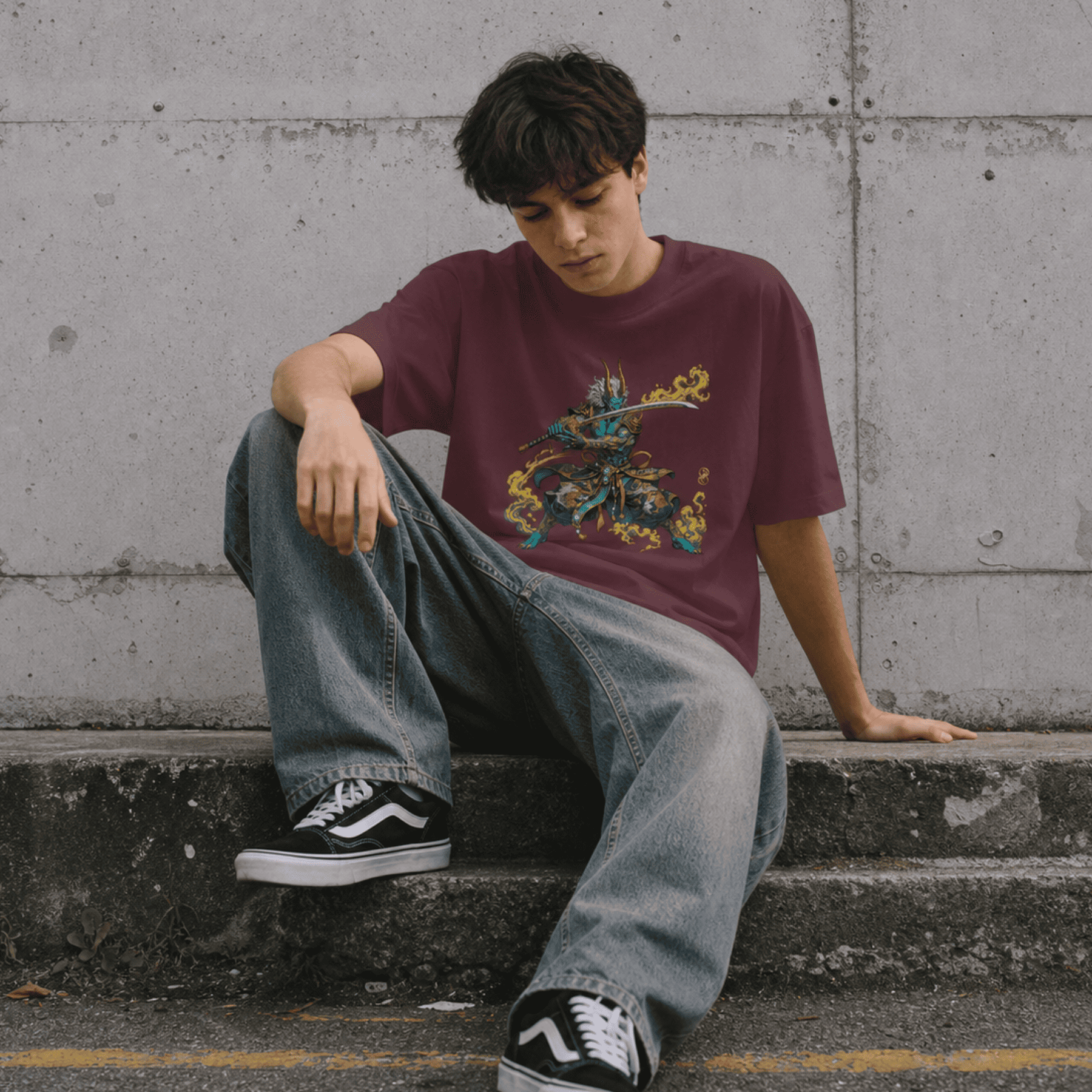 Person wearing a maroon t-shirt with a Oni graphic design, sitting on concrete steps.