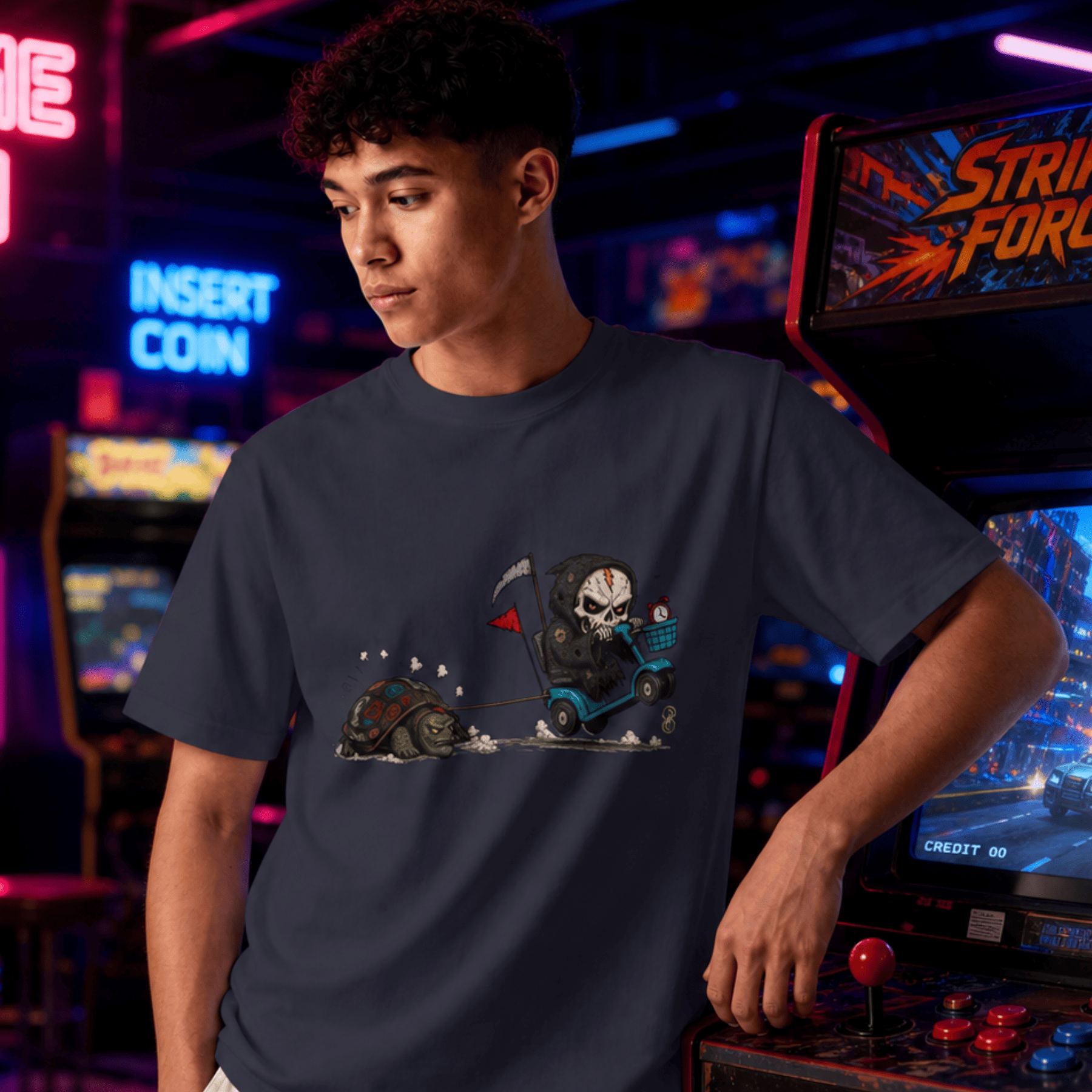 Person wearing a t-shirt with a graphic design in an arcade setting