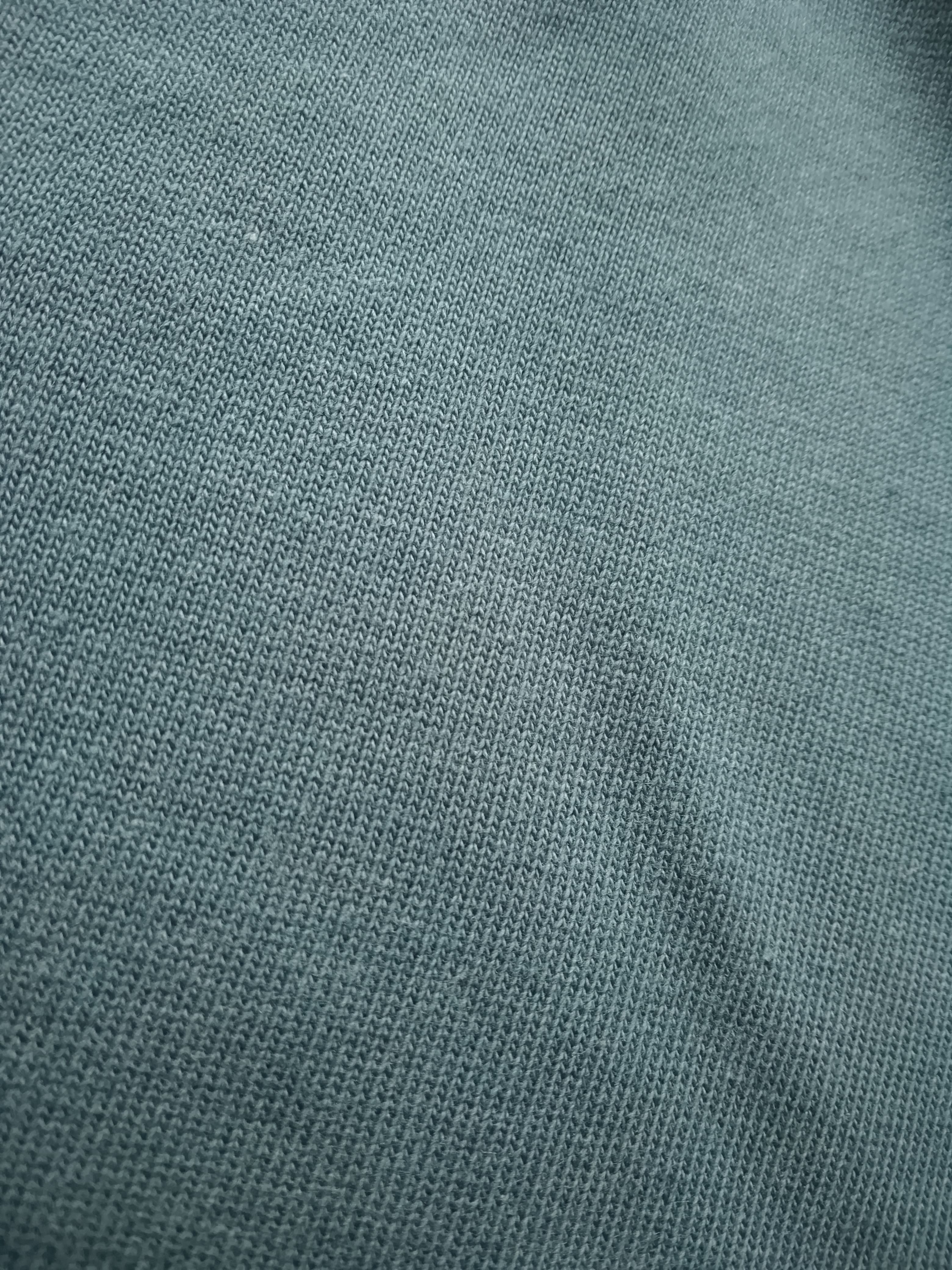 Close-up of teal fabric texture