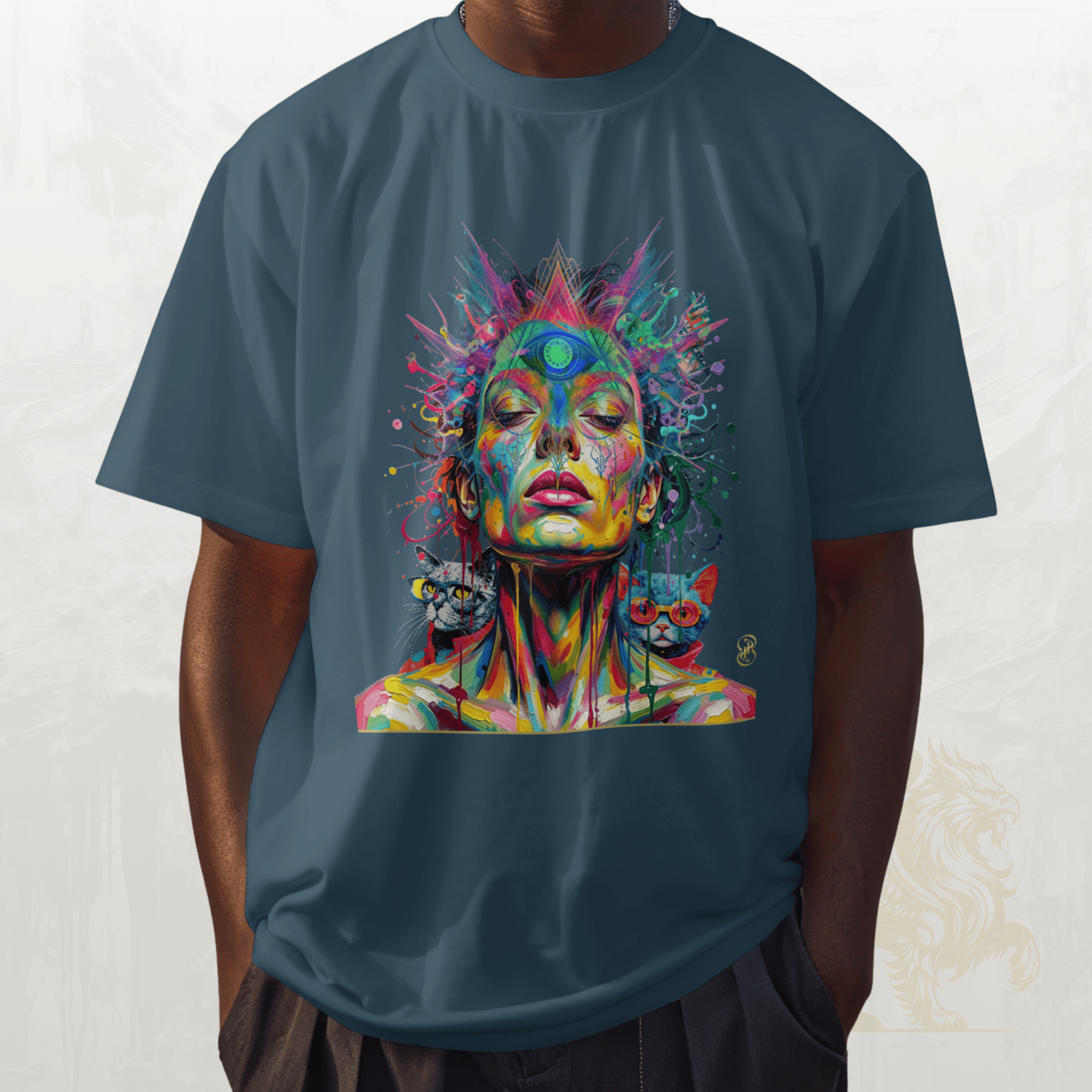 Person wearing a blue t-shirt with a colourful artistic design of a face and cats on a white background