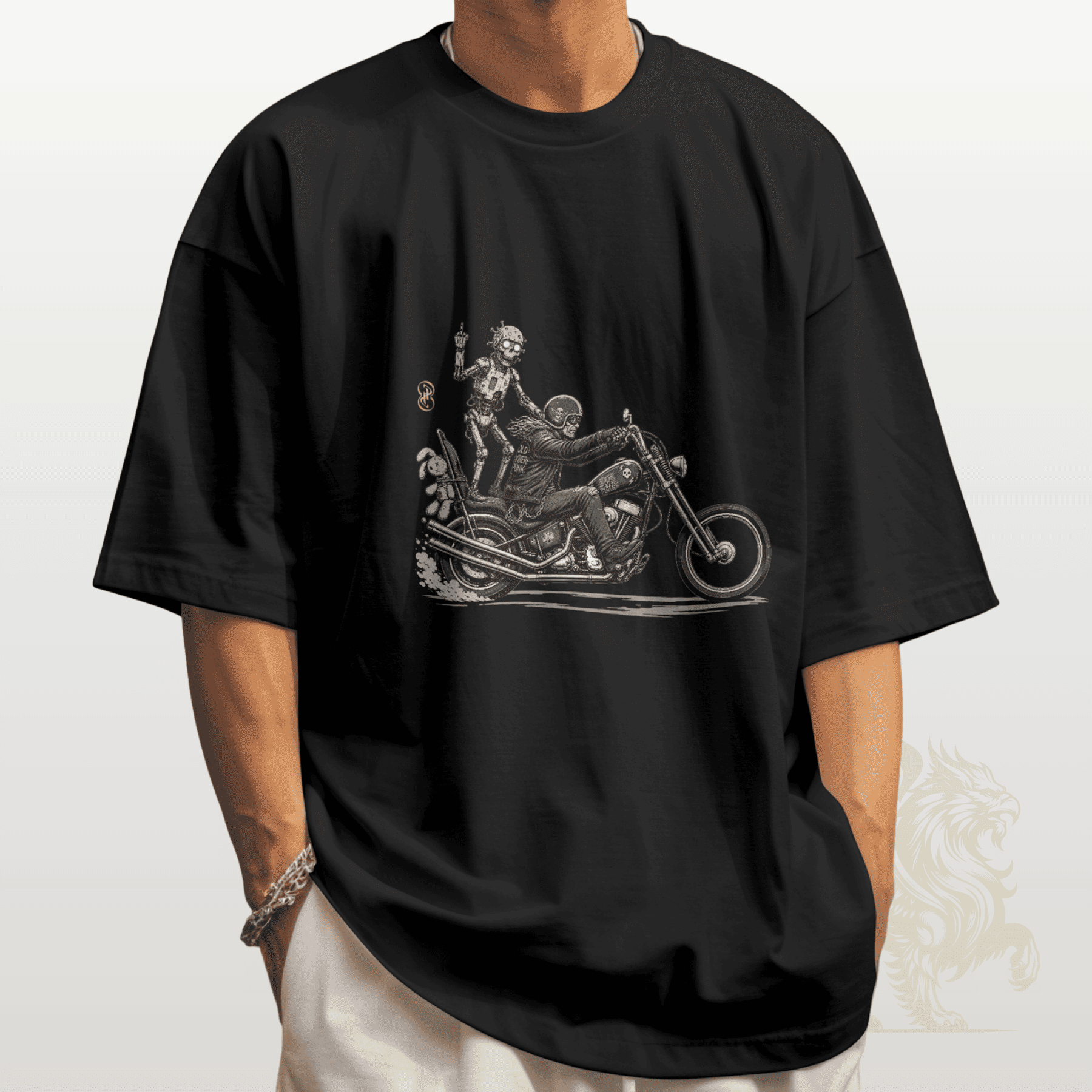 Black t-shirt with a graphic design of two people on a motorcycle worn by a person.