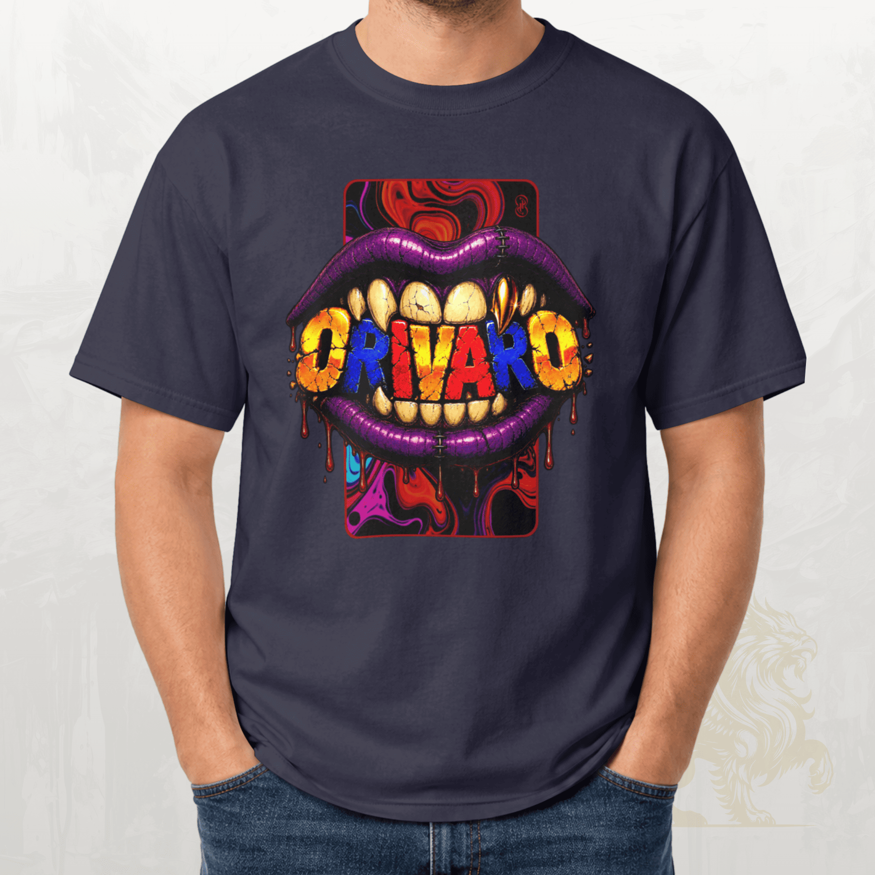 A man wearing a navy blue t-shirt with a colourful graphic of dripping purple lips showing the word 'ORIVARO' in yellow, red, and blue letters, paired with blue jeans.