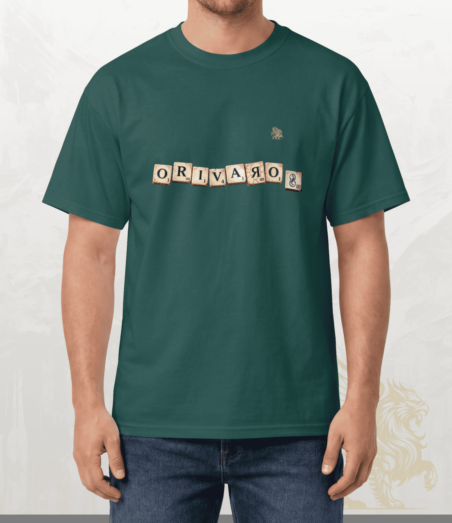 A man wearing a dark green t-shirt with a crossword puzzle-style graphic spelling 'ORIVARO' across the chest, paired with blue jeans, set against a light textured background.