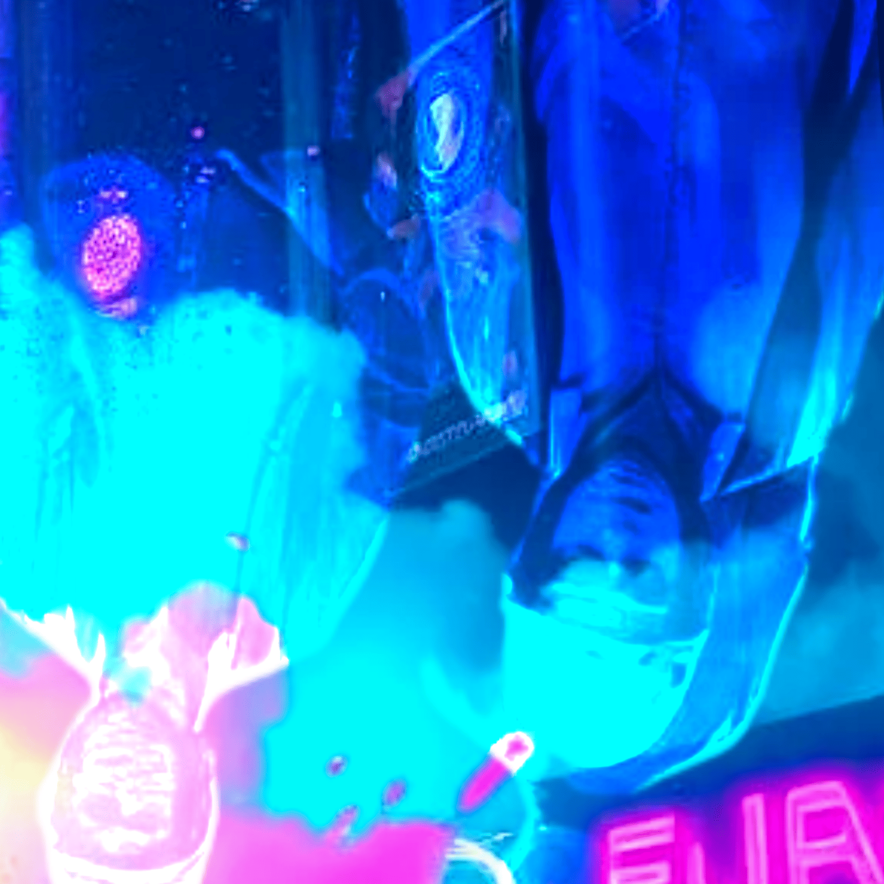 Close up detail of abstract art. this shows some people upside-down.