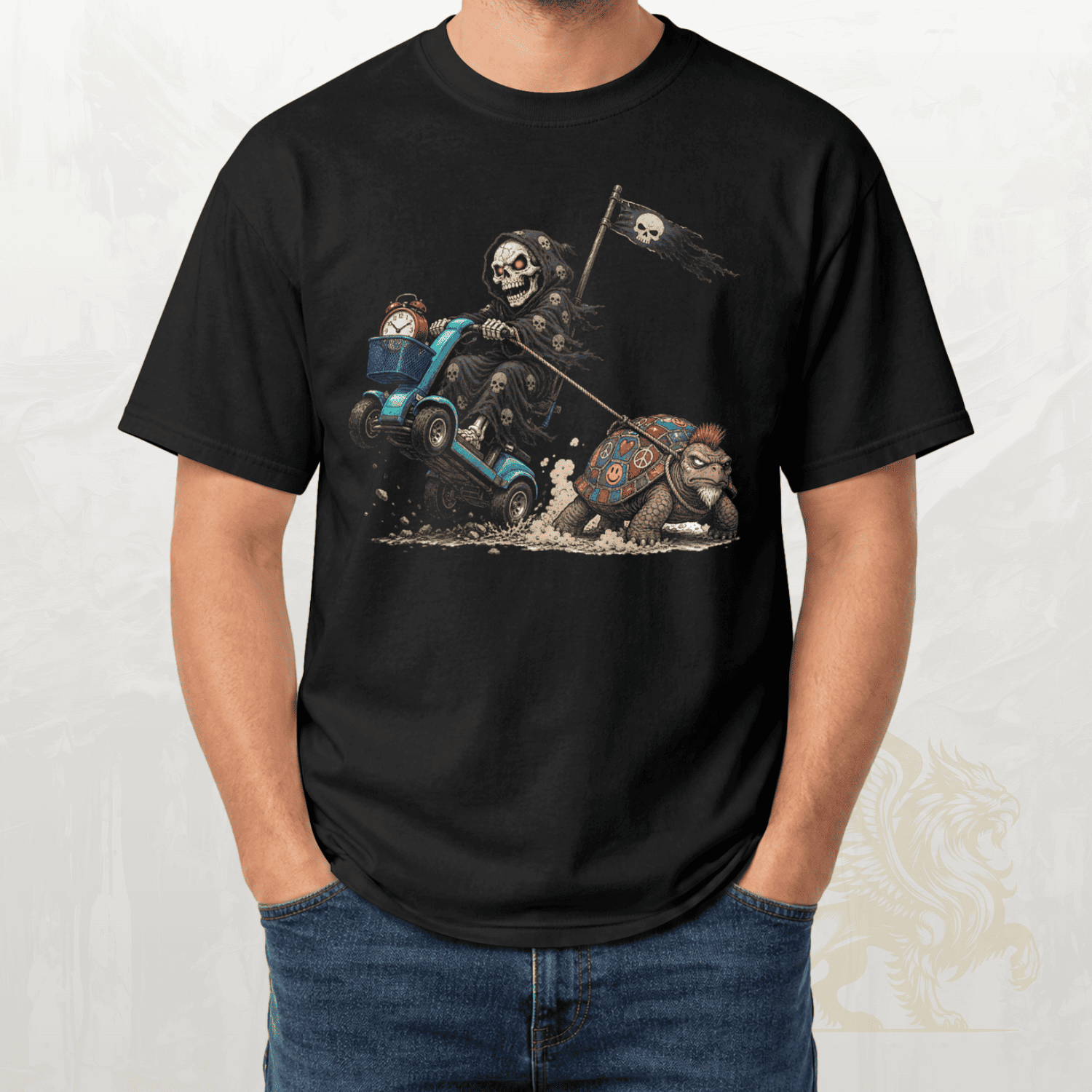 Blue t-shirt with a graphic design of a skull on a motorcycle chasing a tortoise.