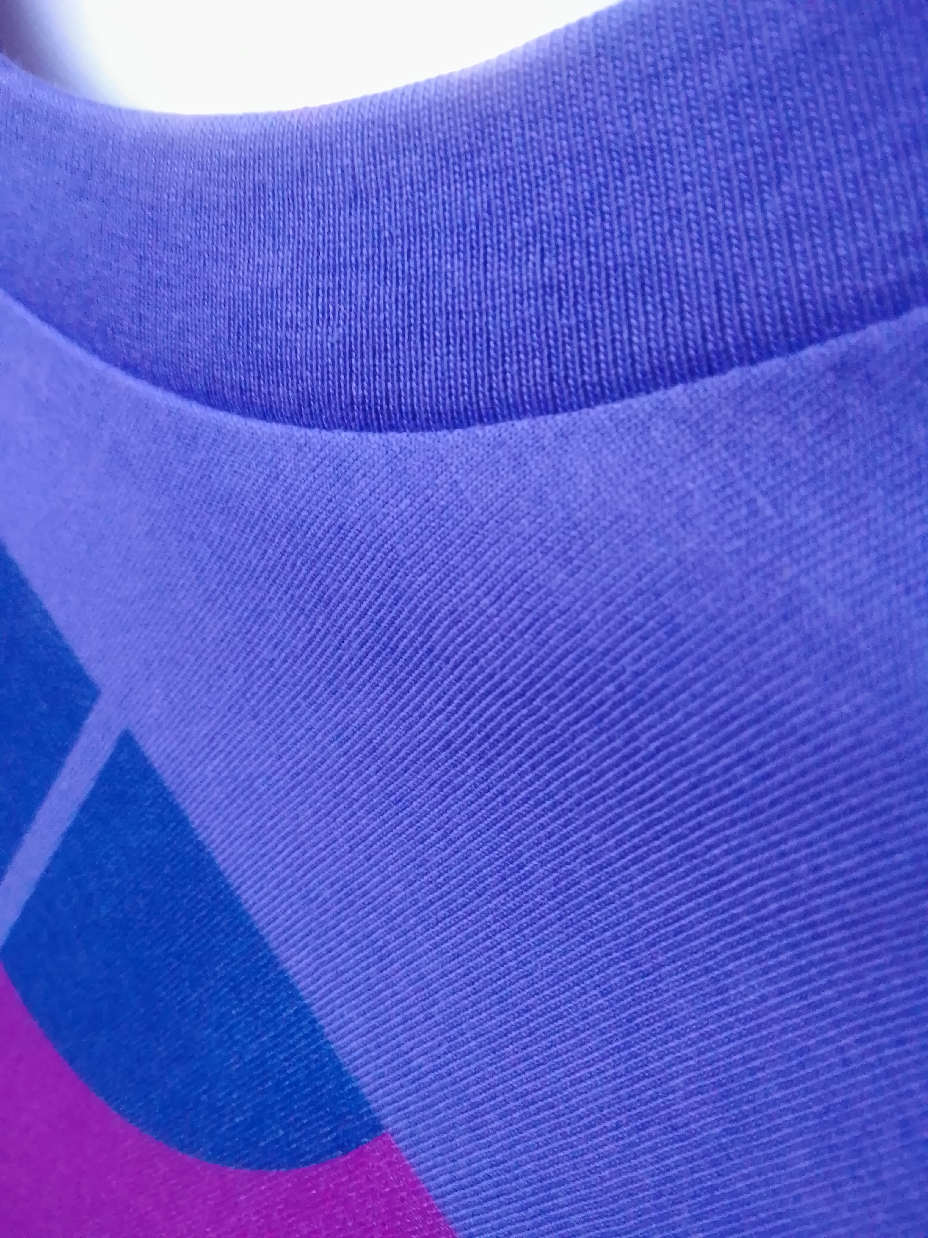 Close-up of a blue fabric with a geometric pattern