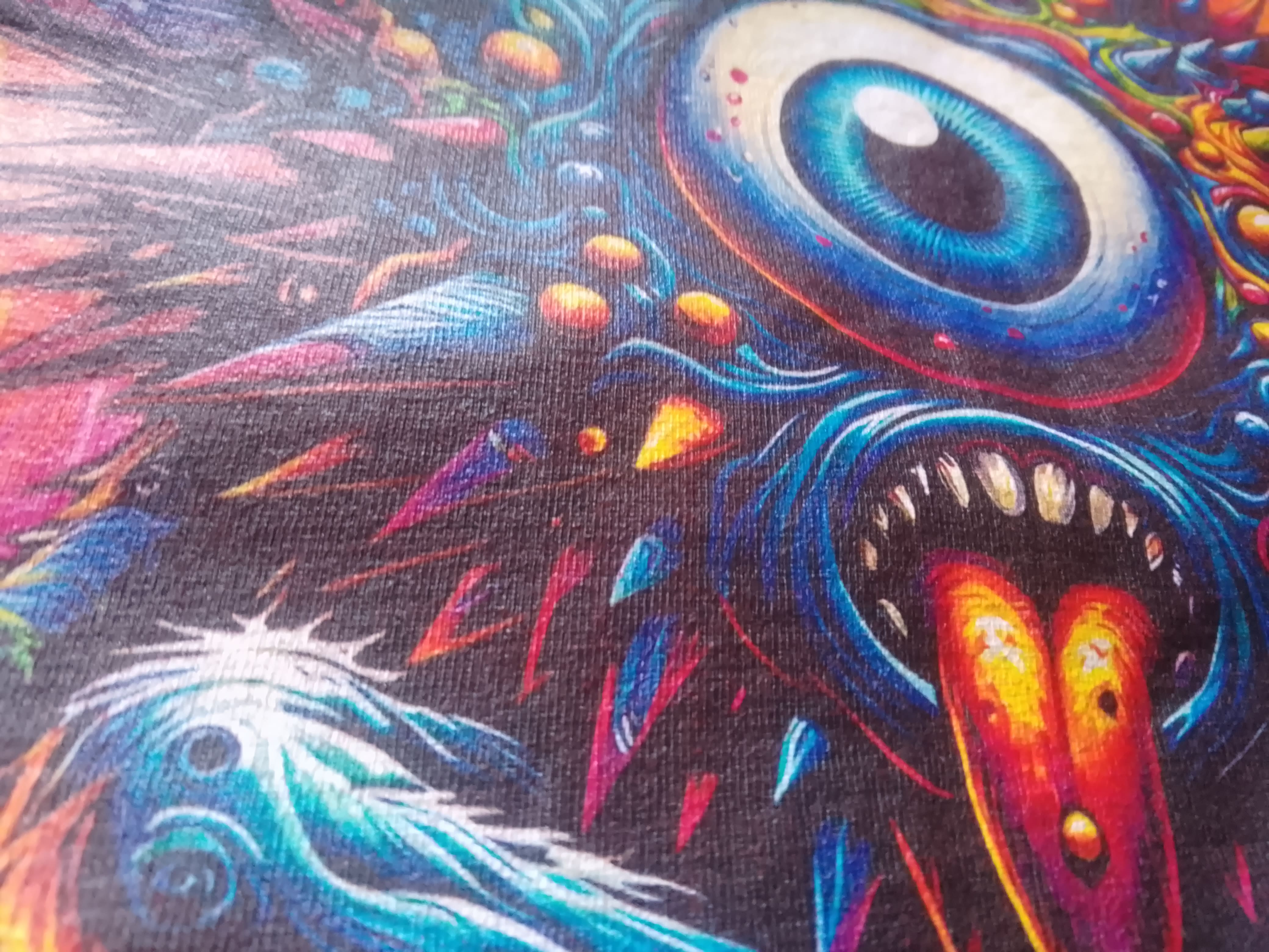 Colorful abstract design with eye-like shapes and vibrant colors on a black background