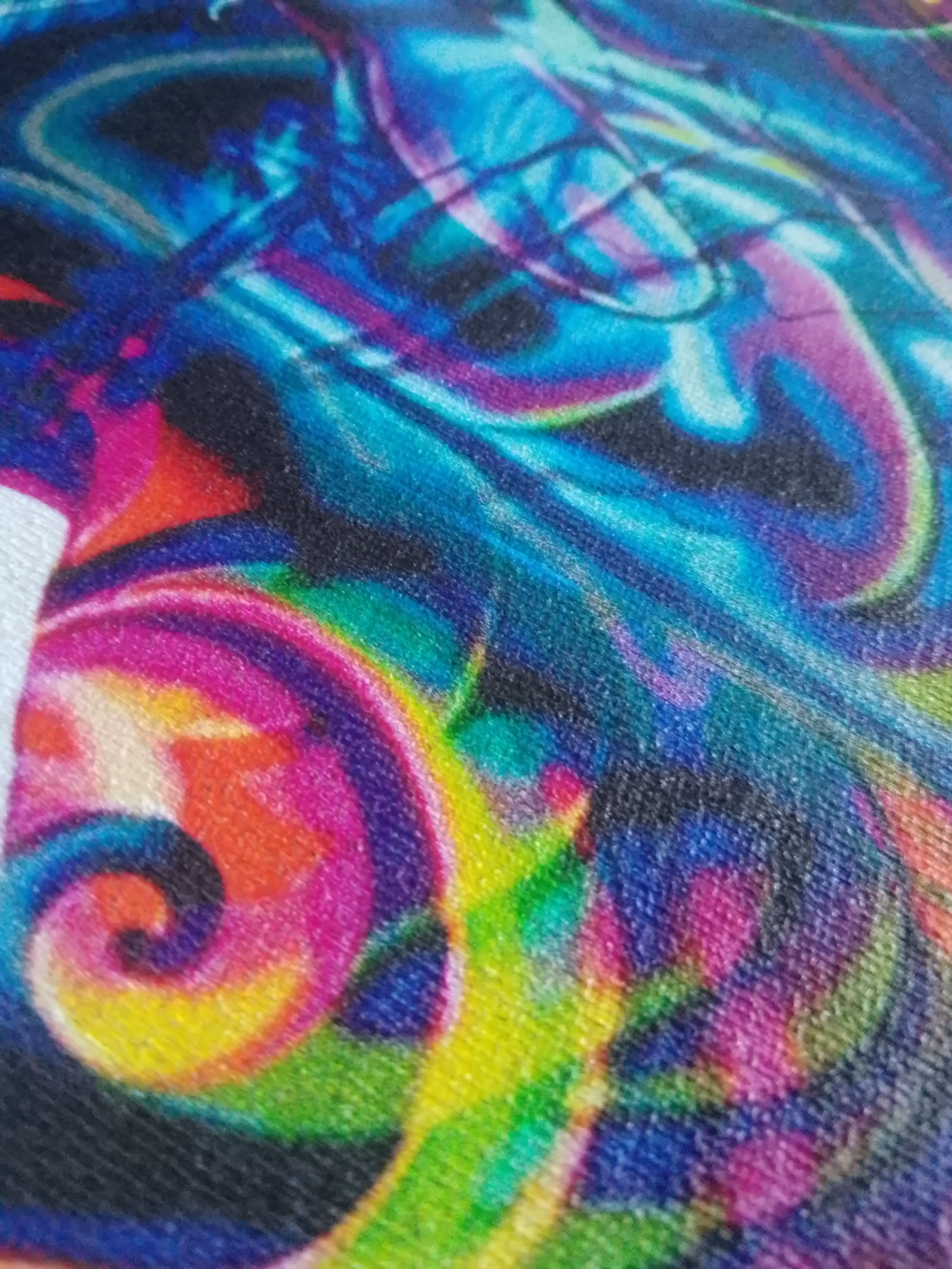 Colorful abstract design with swirling patterns in blue, green, pink, and purple.