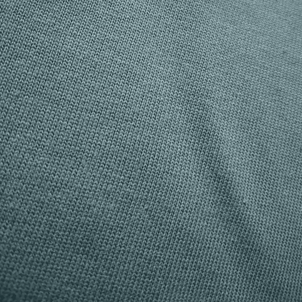 Close-up of a textured knit fabric in a muted slate blue-grey colour.