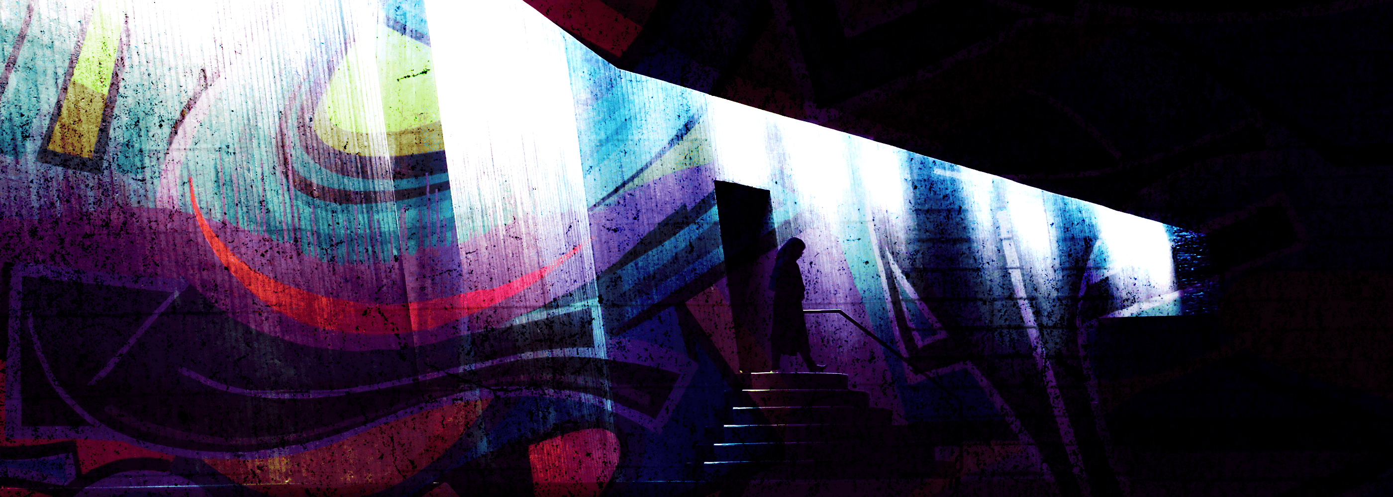 Abstract colorful mural on a wall with a dark foreground