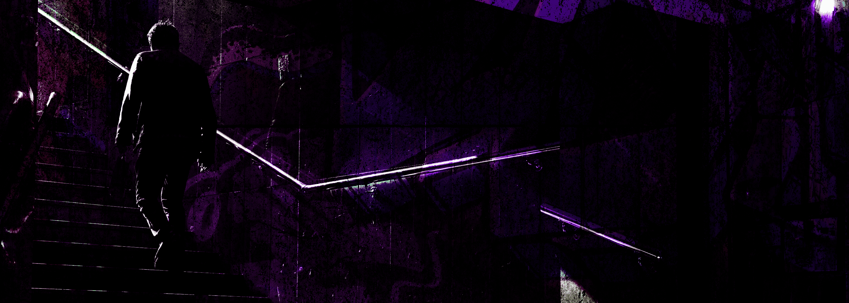Person walking up a dark staircase with purple laser lights