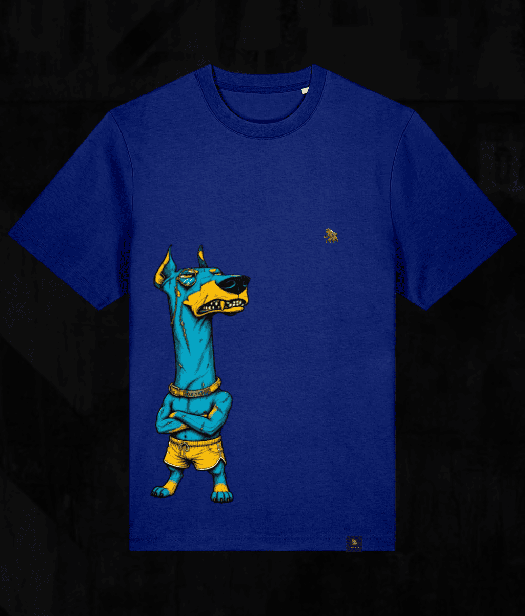 A royal blue short-sleeve t-shirt featuring a graphic print of an Egyptian Anubis dog character in blue and yellow, set against a dark textured background.